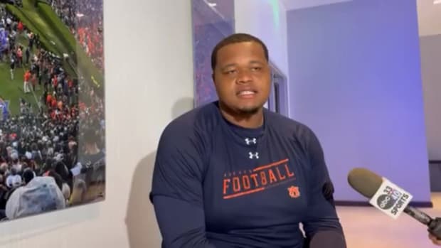 Percy Lewis speaks with the media
